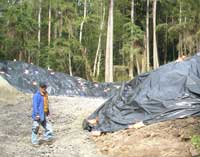 Excavated soil covered with black plastic